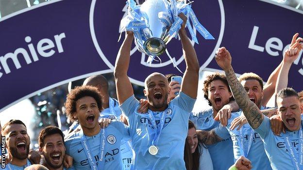 Manchester City lift the Premier League trophy