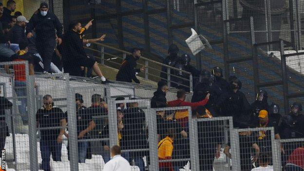 Galatasaray fans throw a chair towards Police