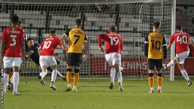Newport keeper Nick Townsend kept out Ian Henderson's penalty early in the second half