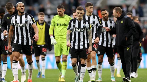 Newcastle players looking disappointed after defeat by Nottingham Forest