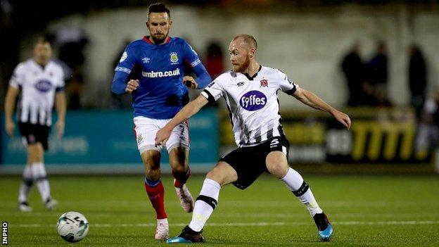 Dundalk's Chris Shields battles with Linfield's Andrew Waterworth at Oriel Park