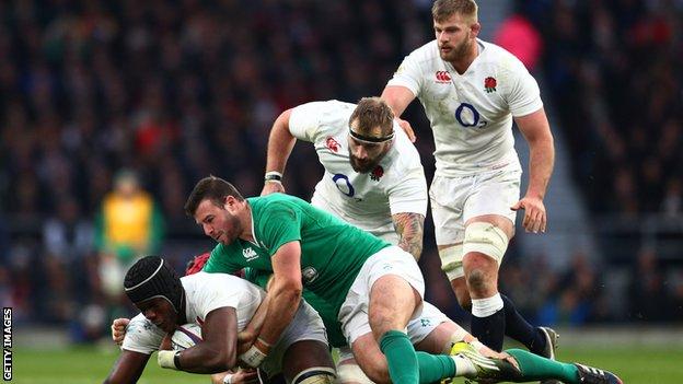 Maro Itoje of England is tackled by Robbie Henshaw of Ireland during the RBS Six Nations match between England and Ireland at Twickenham Stadium on February 27, 2016 in London, England.
