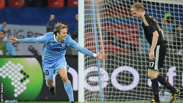 Diego Forlan celebrates scoring against Germany at the World Cup in 2010