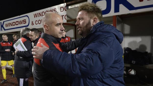 Cliftonville manager Gerard Lyttle with Ards counterpart Niall Currie after watching his side secure the first trophy of his tenure at the Solitude club