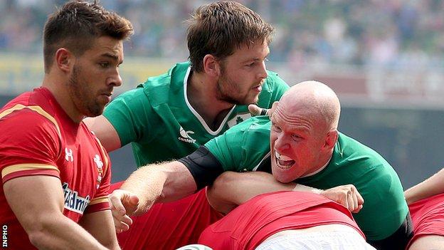 Rhys Webb of Wales in action against Iain Henderson and Paul O'Connell of Ireland