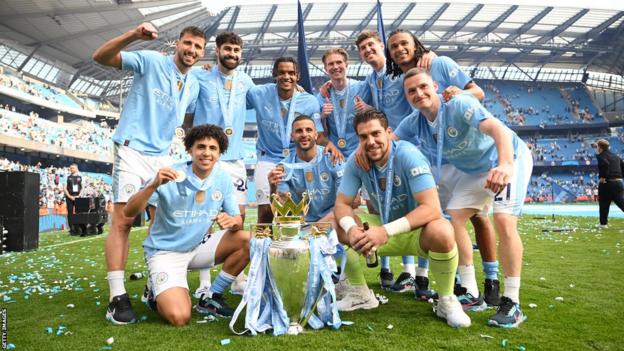 Manchester City players with the Premier League trophy