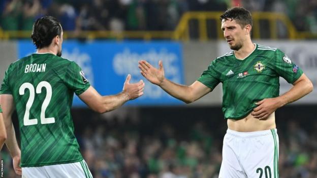 NI defenders Ciaron Brown and Craig Cathcart