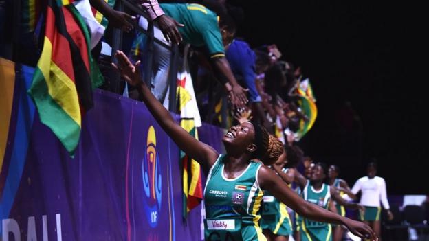 Zimbabwe players line up to high-five fans at the 2019 Netball World Cup