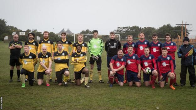 Woolpack Wanderers and Garrison Gunners pose for a team picture