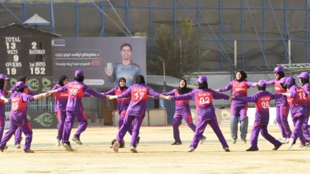 An Afghanistan Cricket Board XI dance on the outfield after a match