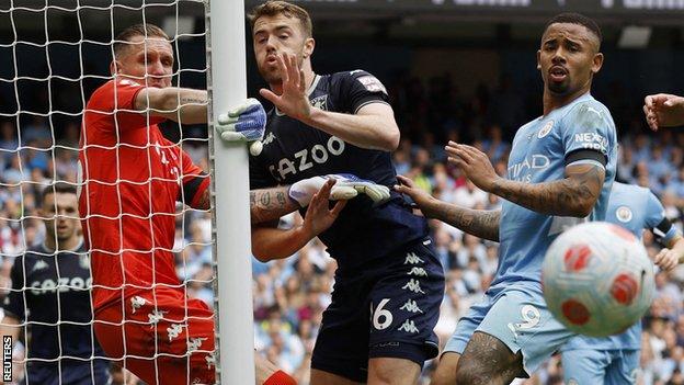 Aston Villa keeper Robin Olsen in action against Manchester City