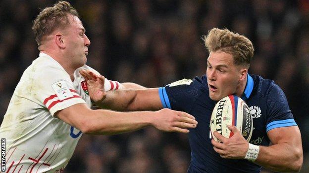 Duhan van der Merwe fends off England number eight Alex Dombrandt