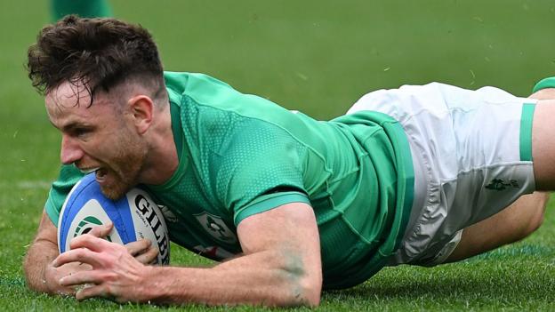 Ireland's Hugo Keenan scoring a try against Italy