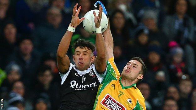 Kilcoo's Dylan Ward battles with Corofin's Dylan Wall in the All-Ireland Club Football Final in January of last year
