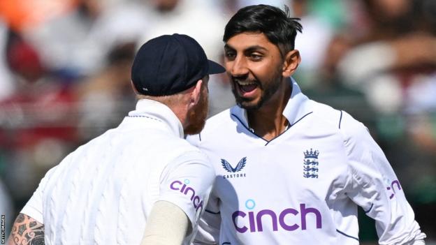 England captain Ben Stokes (left) and spinner Shoaib Bashir (right) celebrate a wicket