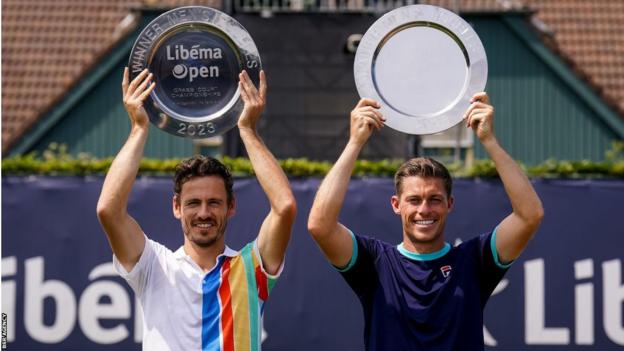 Wesley Koolhof (left) and Neal Skupski holding their trophies