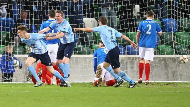 Paddy McNally turns away in delight after heading Ballymena into a first-half lead
