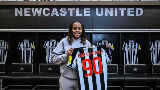 Paige Bailey-Gayle poses with Newcastle shirt