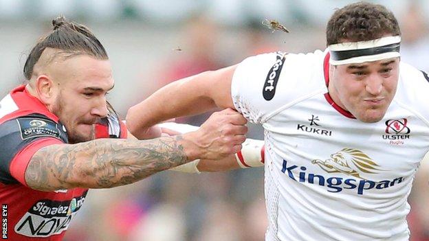 Pierrick Gunther of Oyonnax attempts to stop Ulster's Rob Herring