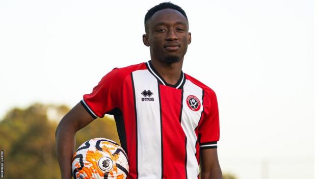 Sheffield United and Ivory Coast player Benie Traore holding a football