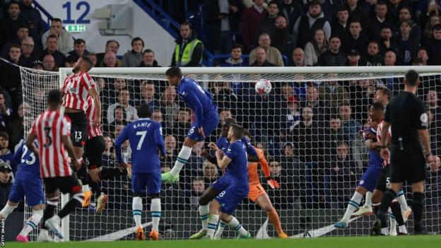 Mathias Jorgensen's flick from a corner hits Cesar Azpilicueta on his shoulder to deflect into the back of the net