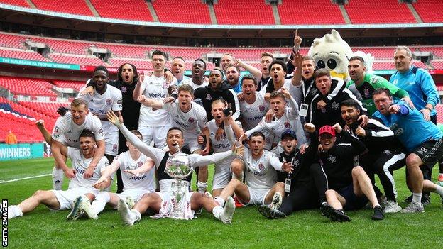 AFC Fylde players celebrate after winning the FA Trophy
