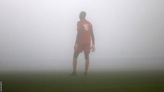 Ibrahim Sesay, goalkeeper of Sierra Leone, looks on in the fog during the 2026 Fifa World Cup qualifier against Ethiopia in El Jadida