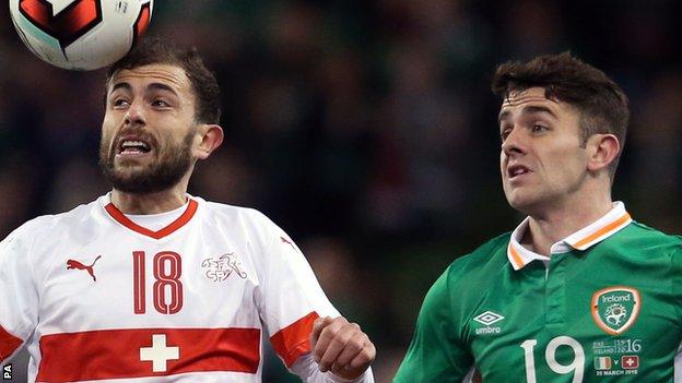 Switzerland's Admir Mehmedi competes with Robbie Brady of the Republic of Ireland