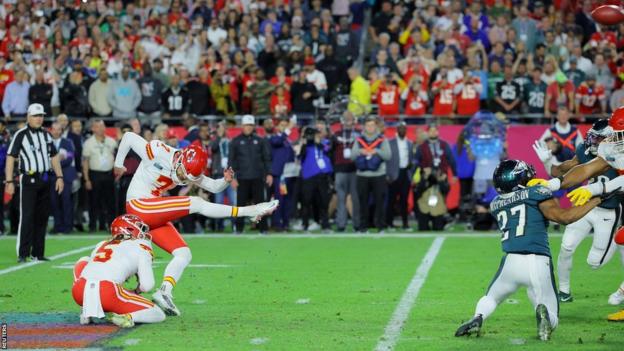 Harrison Butker kicks the winning field goal