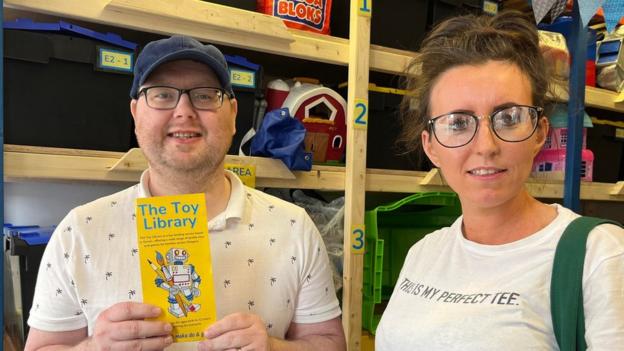 Kieran and Christine McMahon sign up for the toy library.