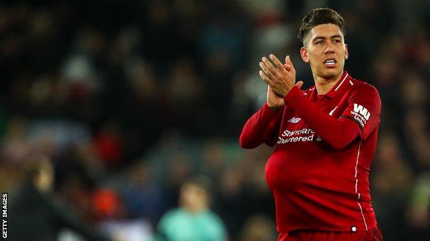 Liverpool striker Roberto Firmino celebrates his hat-trick against Arsenal