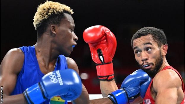 Ghanaian boxer Samuel Takyi in action against USA's Duke Ragan at the Tokyo Olympics