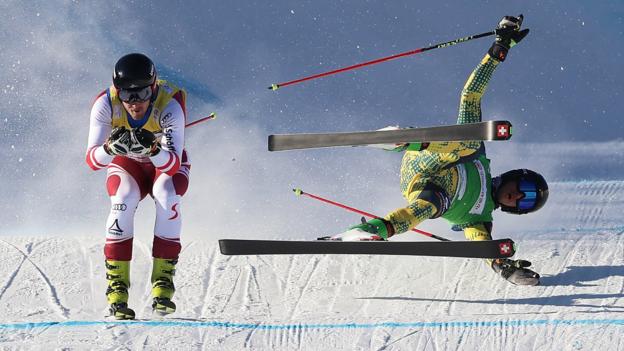 27 November: Germany's Tobias Muller falls as Austria's Johannes Aujesky competes in the men's ski cross at the FIS Cross World Cup in Zhangjiakou, China