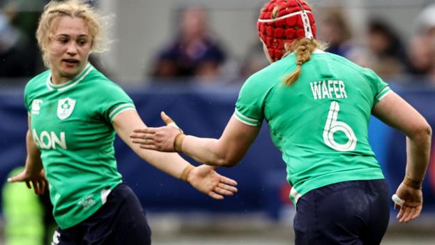 Aoife Wafer celebrates scoring Ireland's opening try with Neve Jones