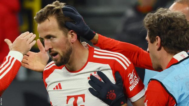 Harry Kane is congratulated by his team-mates after scoring for Bayern Munich against Borussia Dortmund