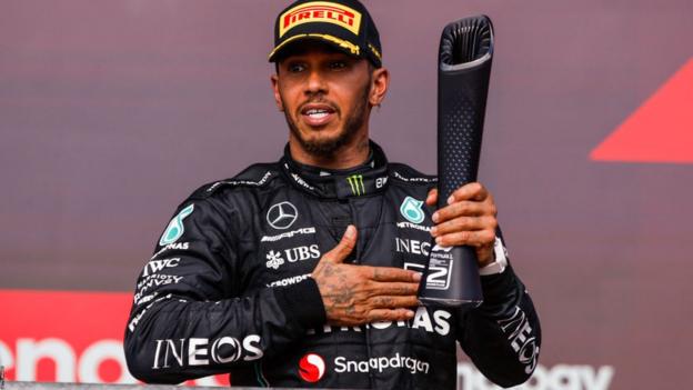 Lewis Hamilton celebrates on the podium in Austin