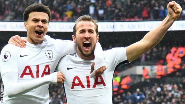 Harry Kane (right) celebrates scoring for Tottenham against Arsenal