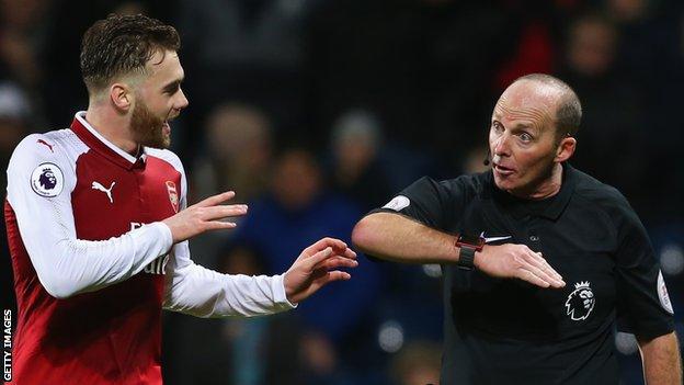 Calum Chambers (left) and Mike Dean