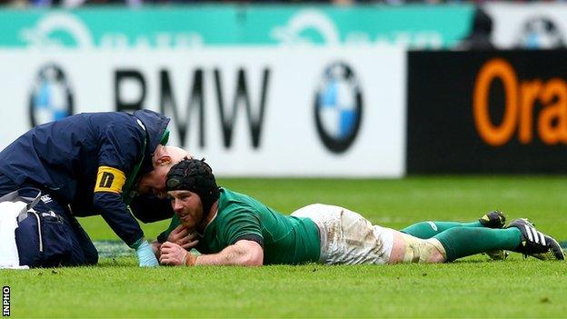 Sean O'Brien receives medical attention following his injury at the Stade de France