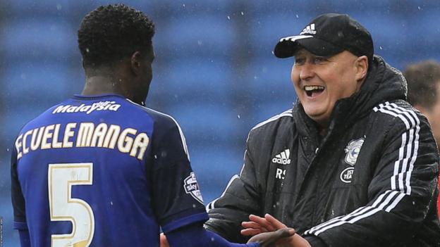 Russell Slade (right) celebrates Cardiff's win against Brighton with Bruno Ecuele Manga