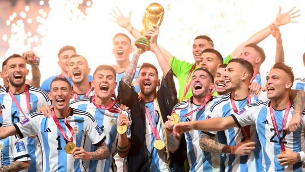 Argentina celebrating with the World Cup trophy after winning the 2022 tournament