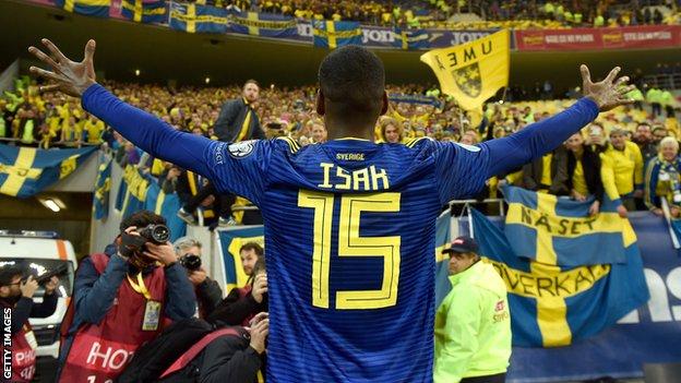Alexander Isak celebrates in front of Sweden fans