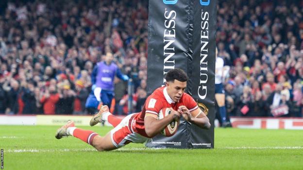 Rio Dyer dives to score a try for Wales against France