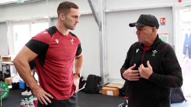George North and Warren Gatland talking during a Wales training session