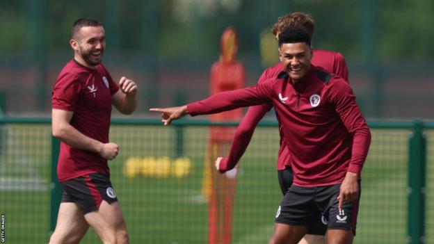 Aston Villa players John McGinn and Ollie Watkins joke during training