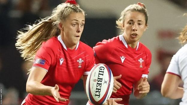 Hannah Jones has support from Elinor Snowsill against England