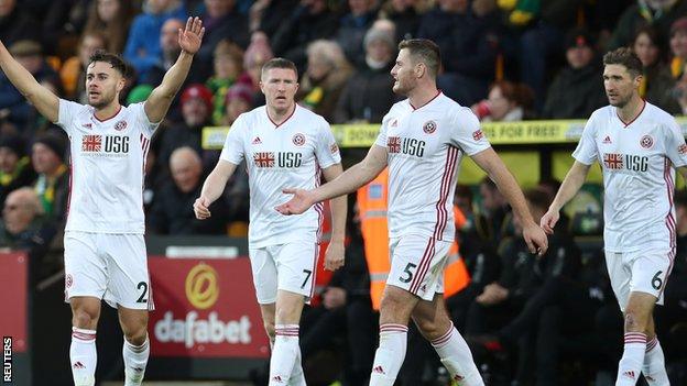 George Baldock celebrates