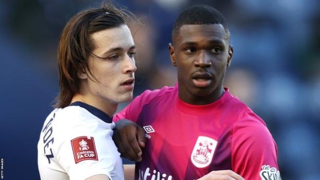 Loick Ayina, right, made his first appearance for Huddersfield in the FA Cup in January
