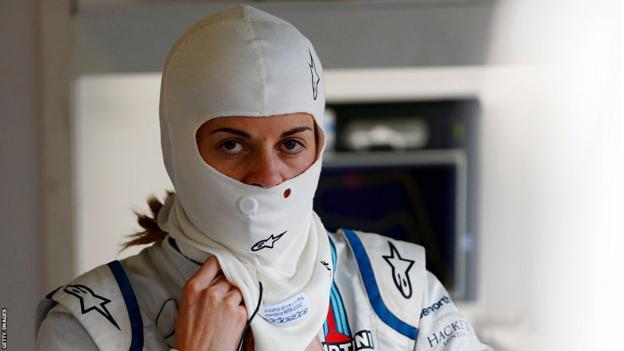 Susie Wolff is adjusting her white balaclava