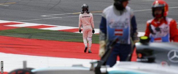 Nico Rosberg walks away dejected after losing control on his flying lap